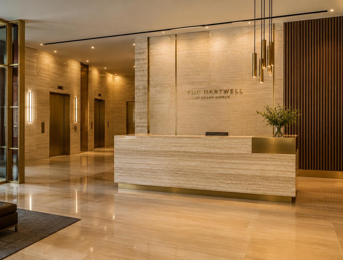 Stone-clad reception lobby with brass lighting